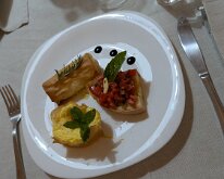2025-10-15 19.11.43 Three appetizers: pears in phyllo pastry, quiche and another